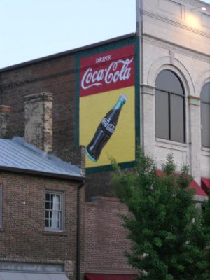 Repainted Coca-Cola sign on building