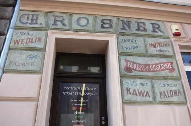 Hand painted signage around a doorway