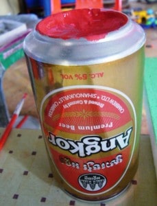 Improvised pallette in beer can in Cambodia