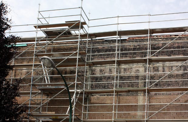 Scaffolding on a ghostsign for the Little Theatre in Vancouver