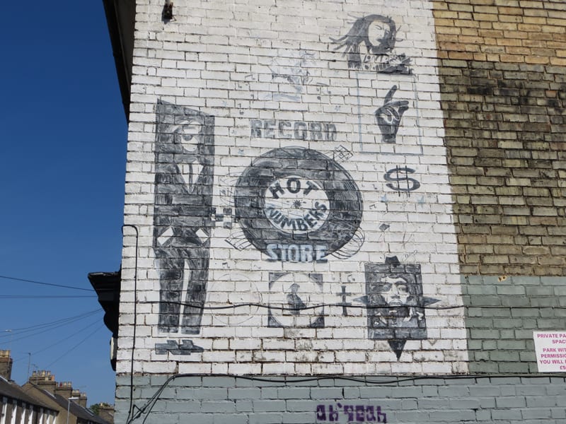 Painted sign on a wall in Cambridge
