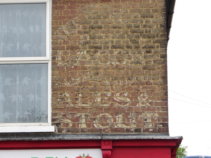 Painted sign on a wall in Cambridge