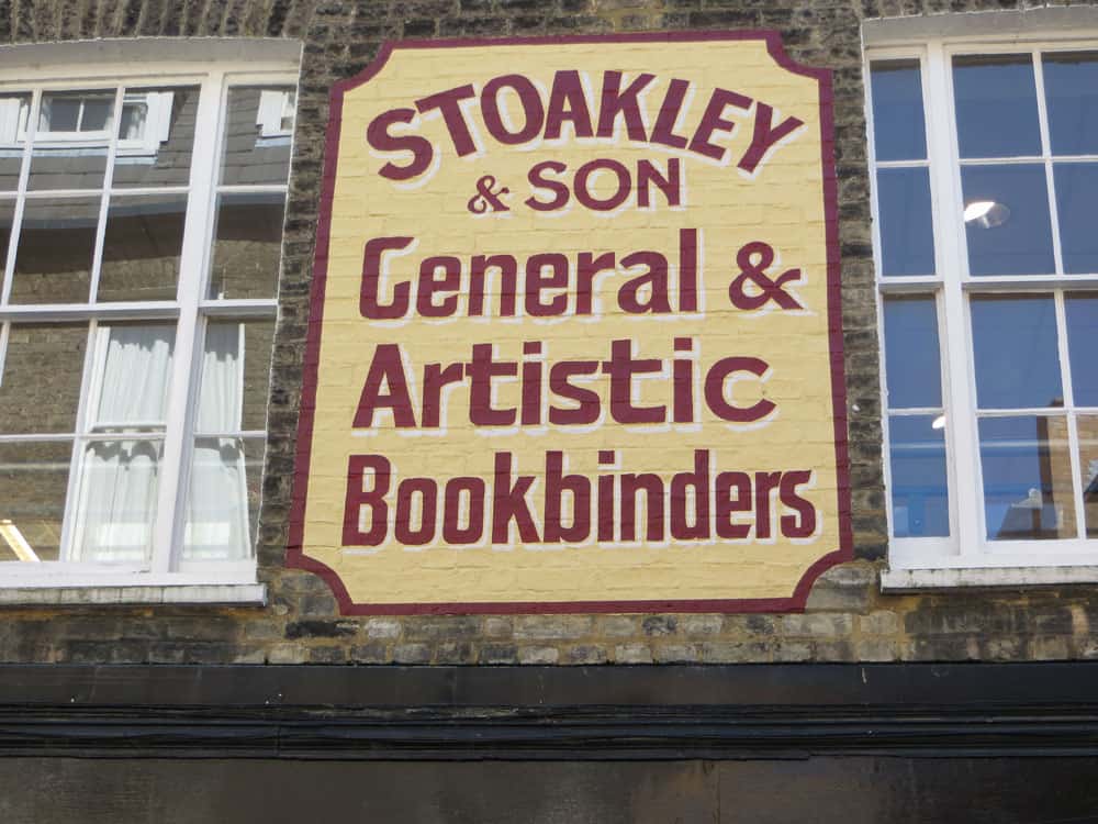Painted sign on a wall in Cambridge
