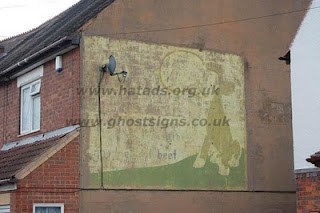 Bovril ghostsign by Ash Humby Faded hand painted sign on a building with a cow illustration advertising Bovril