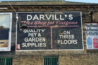 Darvill's ghostsign by Mark Fielding Hand painted sign on a building advertising Darvill's shop