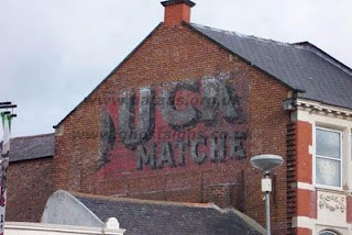 Puck Matches ghostsign by Richard Slater Partial remains of a hand painted sign on a building advertising Puck Matches