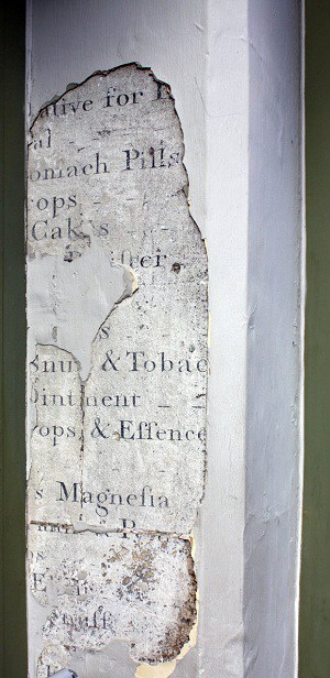 Chemist at Porter Close Up by Kirsten Elliott Portion of wall removed to reveal early 1800s hand painted sign