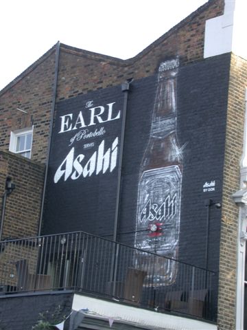 Asahi beer by Ross Corben close Hand-painted sign advertising Asahi beer on side wall of pub