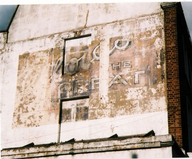 Hand-painted wall sign advertising unknown brand