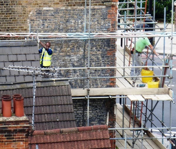 Scaffolding going up on one of Stoke Newington's famous ghostsigns