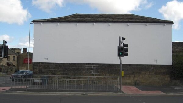 Work in progress on restoration for painted wall sign for Larkspur Drinks