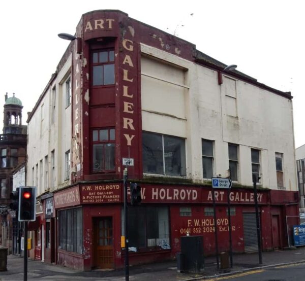 Painted signage on shopfront for F.W. Holroyd