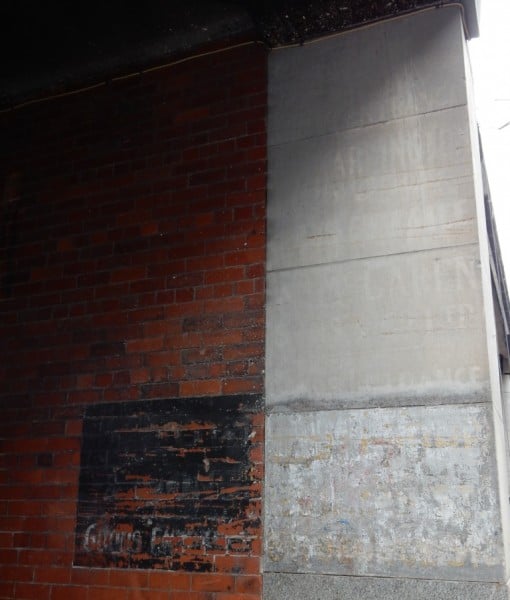 Fading signs on a Glasgow goods entrance