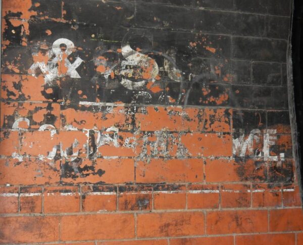 Fading goods entrance sign