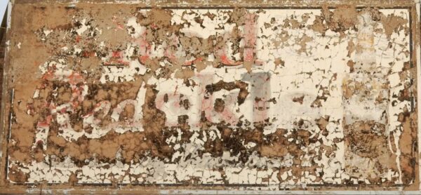 Cracking paint from a sign for Red Hackle Whisky.