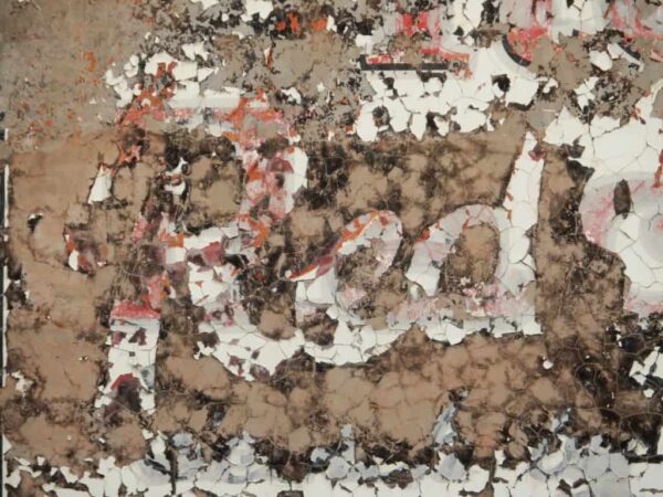 Cracking red paint on the word Red
