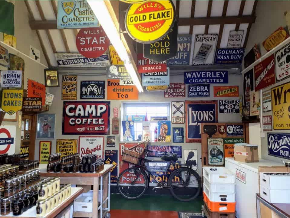 Enamel advertising signs on display in the Jam Factory, Anglesey.
