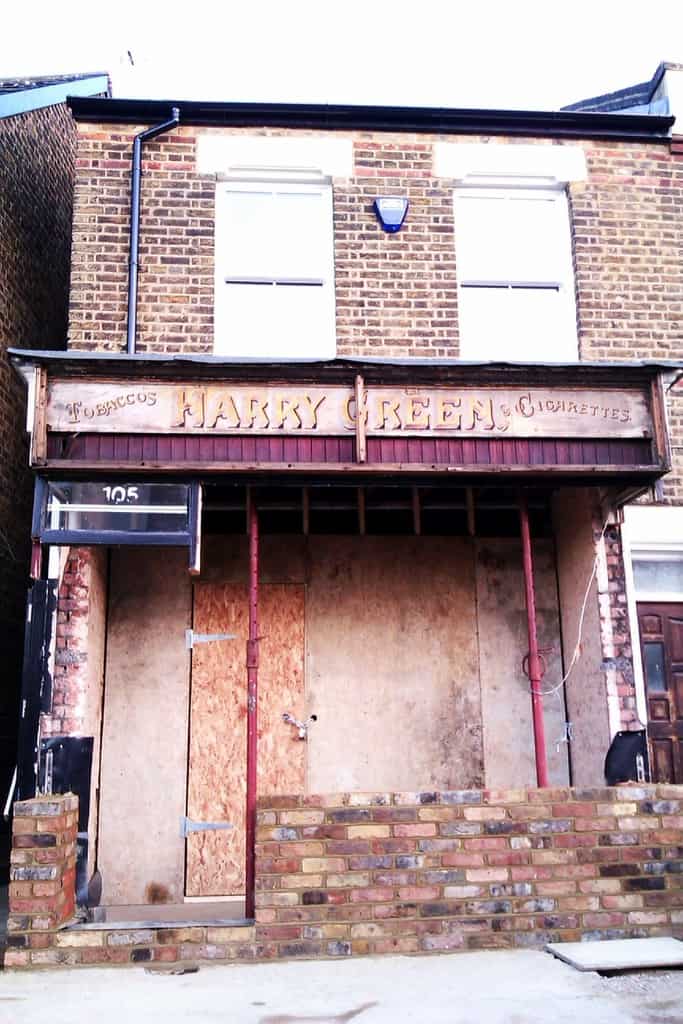 Building site with old Harry Green painted shop front showing.